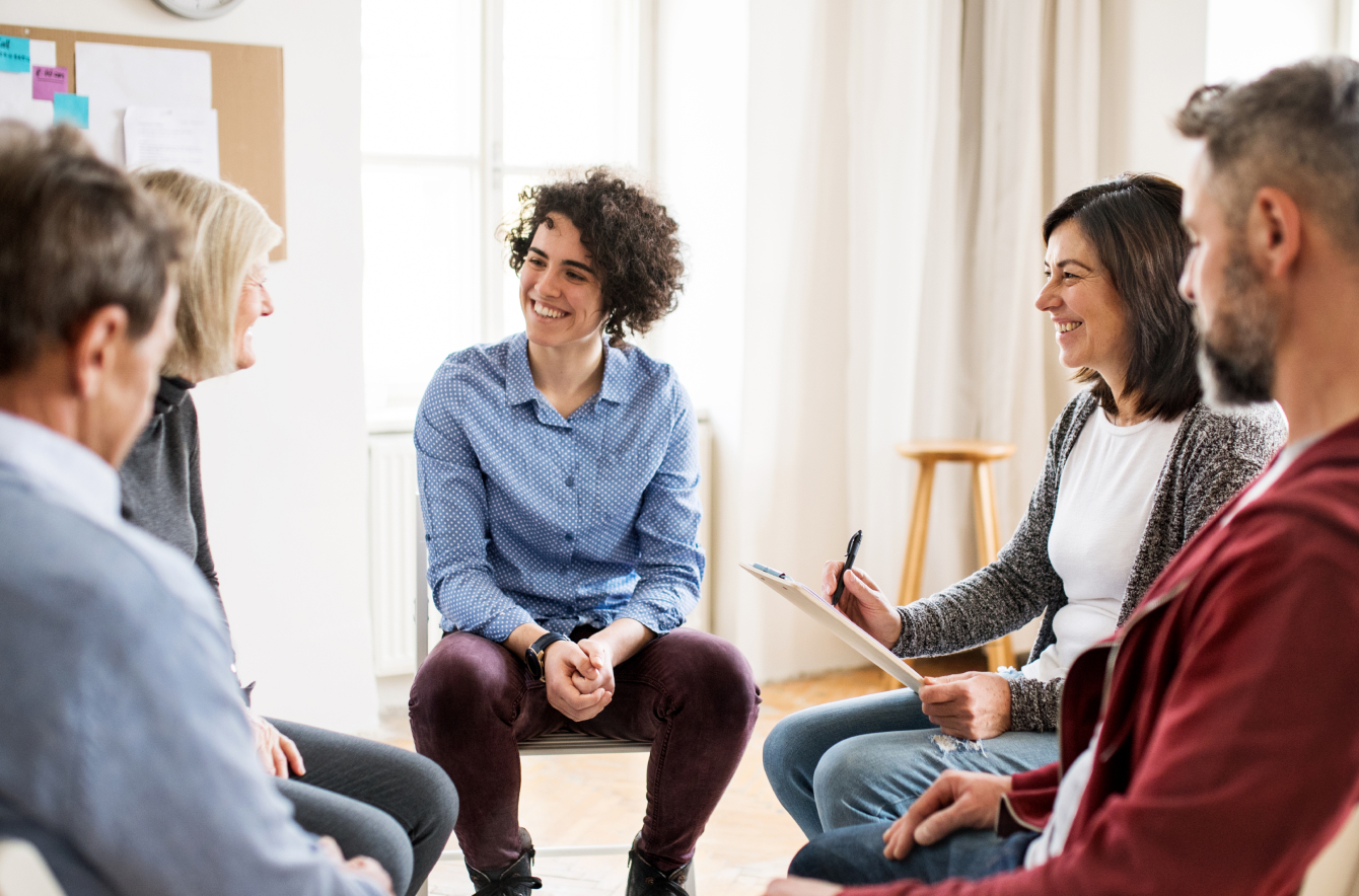 people talking in a group counseling session