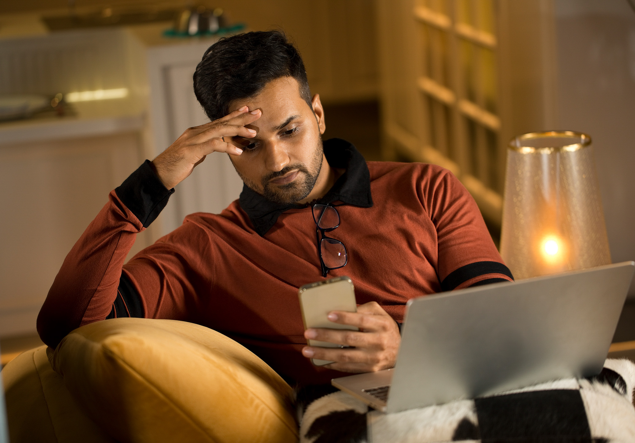 Man feeling depressed on receiving bad news using phone