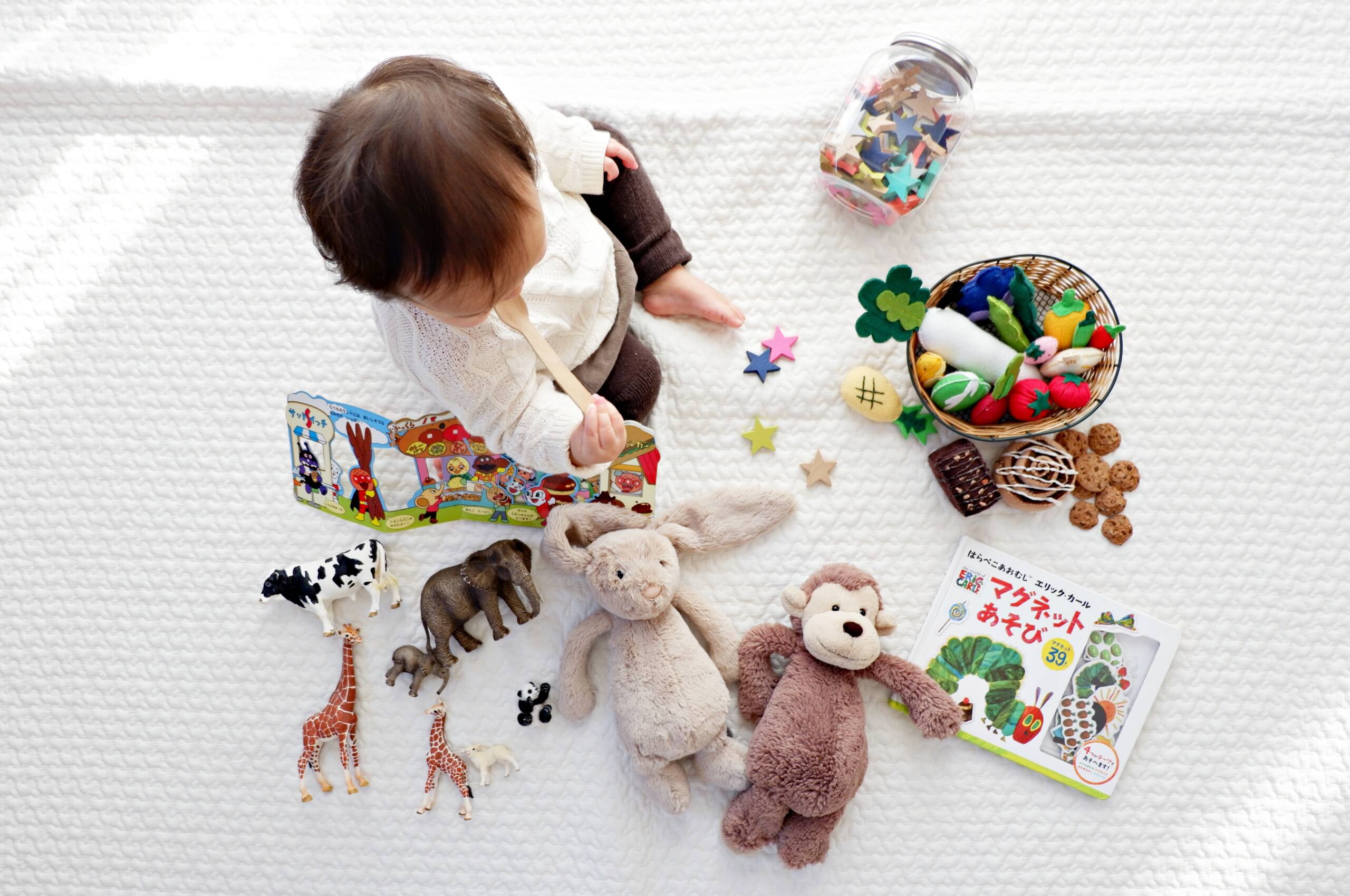 young child playing with toys