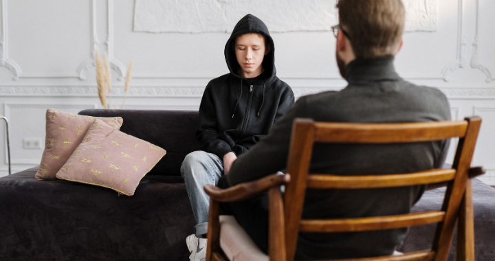 boy talking to counselor